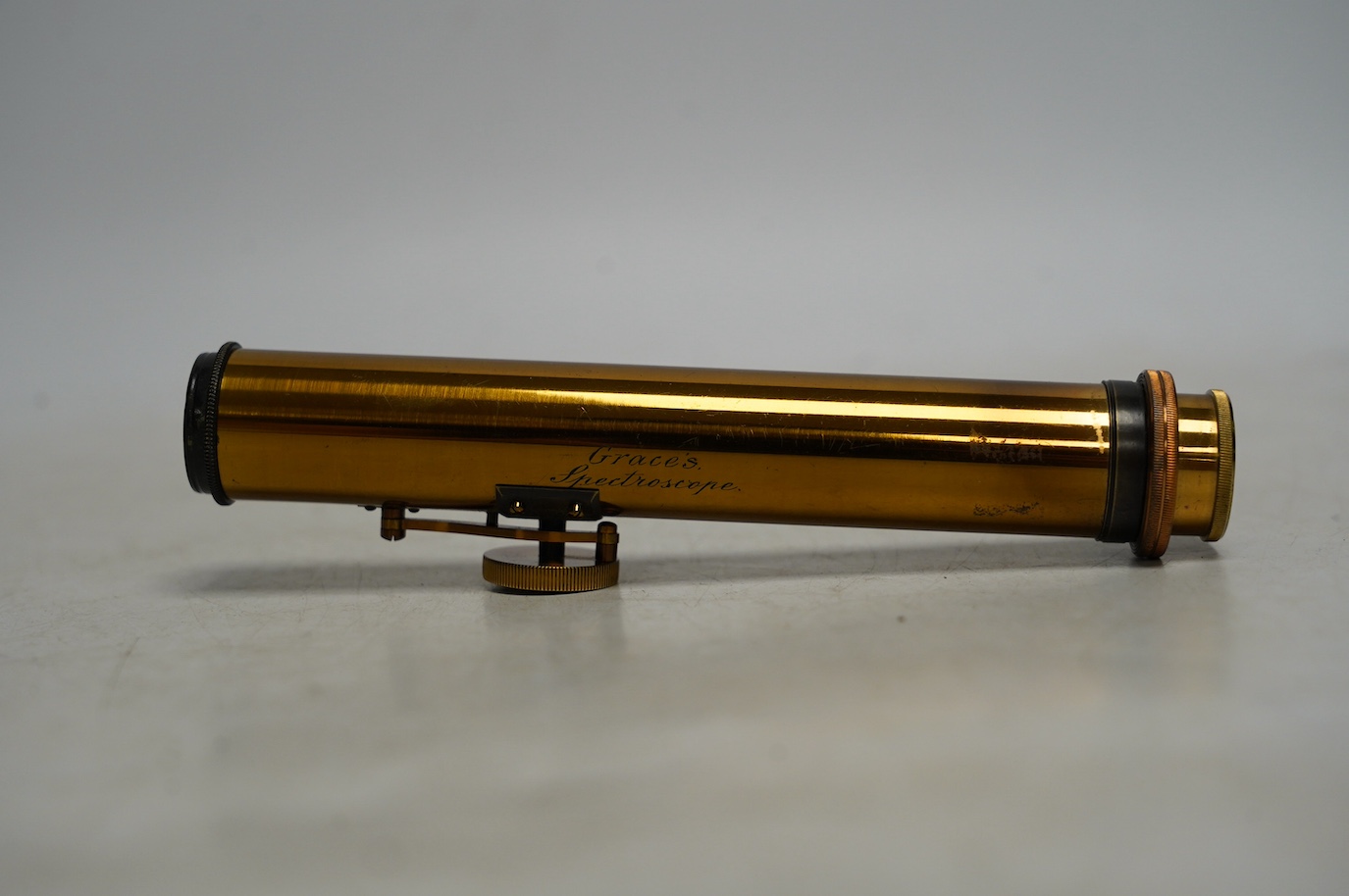 A late 19th century brass pocket spectroscope, engraved ‘Grace’s Spectroscope’, John Browning, 68, Strand, London, 14.5cm. Condition - fair